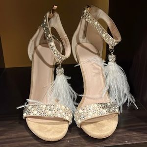 White and beige heels with feathers